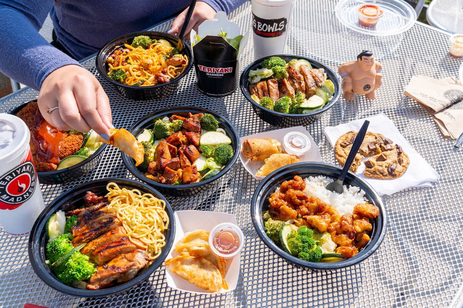 Teriyaki Madness food spread at a restaurant location.